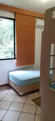 Uma cama ou camas num quarto em Um refúgio à Beira mar