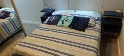 Uma cama ou camas num quarto em Meia Praia Apto Fino Acabamento 3 suítes e 2 garagens