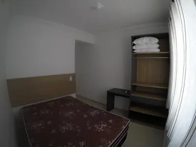 Uma cama ou camas num quarto em Residencial Água belas bombinhas