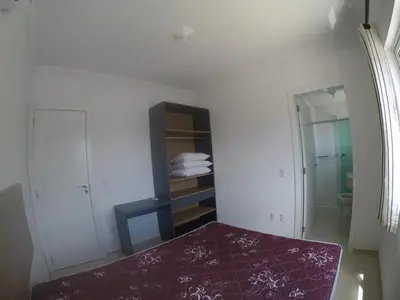 Uma cama ou camas num quarto em Residencial Água belas bombinhas