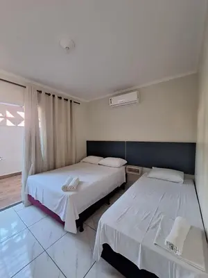 Uma cama ou camas num quarto em Bombas Beach