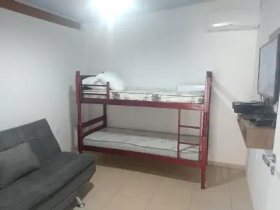 Uma cama ou camas num quarto em Casa com piscina