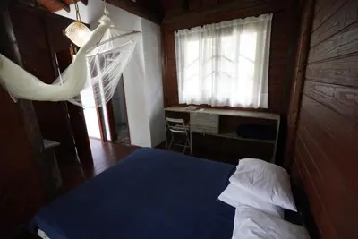Uma cama ou camas num quarto em Casa alquiler en Bombas Bombinhas