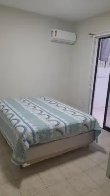 Uma cama ou camas num quarto em Meu verao em ITAPEMA