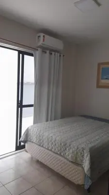 Uma cama ou camas num quarto em Meu verao em ITAPEMA