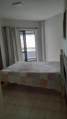 Uma cama ou camas num quarto em Meu verao em ITAPEMA