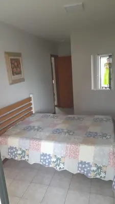 Uma cama ou camas num quarto em Meu verao em ITAPEMA