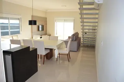 Uma área de estar em Belíssima Casa - Pé na areia - Bombinhas - Canto Grande