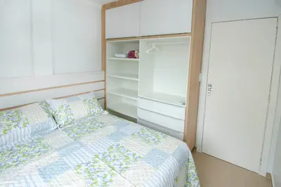 Uma cama ou camas num quarto em CAMILA