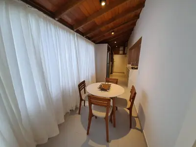 Uma área de estar em Vivencie Esta Experiência Beira Mar
