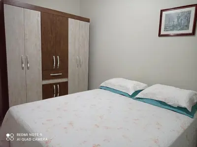 Uma cama ou camas num quarto em Apartamento em Bombinhas