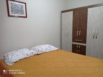 Uma cama ou camas num quarto em Apartamento em Bombinhas