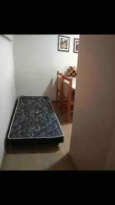 Uma cama ou camas num quarto em ANSNEGOCIOS KIT-NET PRAIA MARISCAL 203 Maguelli