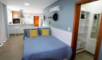 A cozinha ou kitchenette de Flat Vista para o Mar e Piscina em Bombinhas 1082