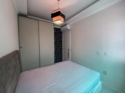 Uma cama ou camas num quarto em Lago Maggiore - 101 - 3º Andar - Com área externa