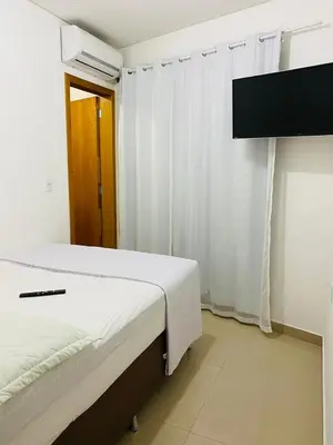 Uma cama ou camas num quarto em Pousada Wall Paraíso
