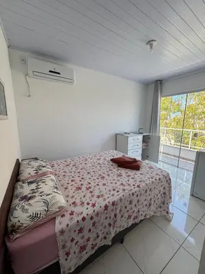 Uma cama ou camas num quarto em Residencial Dona Duda
