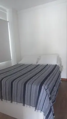 Uma cama ou camas num quarto em Loft no Residencial Marbella à 300 metros da praia