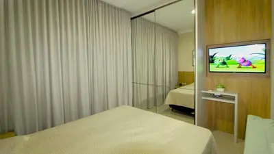 Uma cama ou camas num quarto em 1072 - Apartamento 3 suítes Alto Padrão com SPA na Praia de Bombinhas