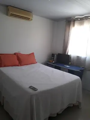 Uma cama ou camas num quarto em Residencial helena cobertura