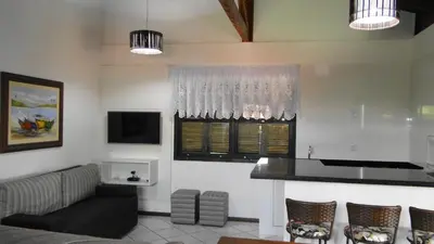 Uma televisão e/ou sistema de entretenimento em Residencial Beija Flor apartamento 31