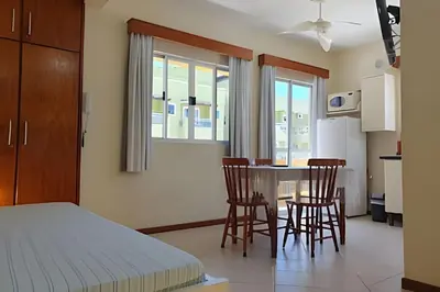 Uma cama ou camas num quarto em Pousada Acapulco