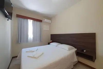 Uma televisão e/ou sistema de entretenimento em Pousada Acapulco