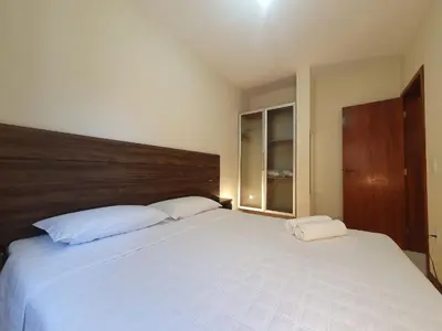 Uma cama ou camas num quarto em Pousada Acapulco