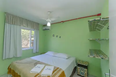 Uma cama ou camas num quarto em Pousada Recanto Dom Arthur