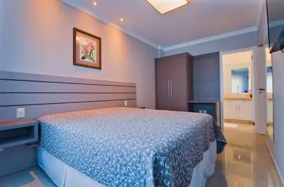 Uma cama ou camas num quarto em Baía dos Golfinhos