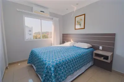 Uma cama ou camas num quarto em Baía dos Golfinhos