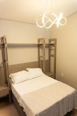 Uma cama ou camas num quarto em Casa Vista Mar com Ofurô - Condomínio com piscina