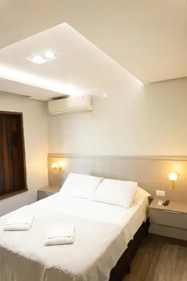Uma cama ou camas num quarto em Casa Vista Mar com Ofurô - Condomínio com piscina