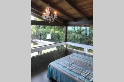 Uma cama ou camas num quarto em 5. Cobertura com Vista Mar 360º Bombinhas