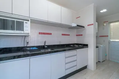 A cozinha ou kitchenette de Aluguel Apartamento 2 quartos vista mar Bombas/SC