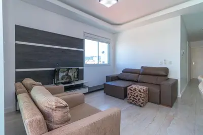 Uma área de estar em Aluguel Apartamento 2 quartos vista mar Bombas/SC
