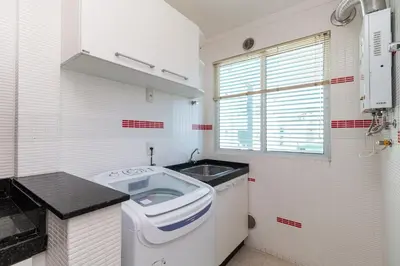 A cozinha ou kitchenette de Aluguel Apartamento 3 quartos vista mar Bombas SC