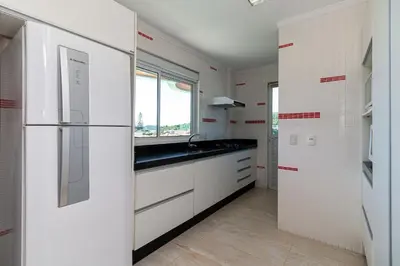 A cozinha ou kitchenette de Aluguel Apartamento 3 quartos vista mar Bombas SC
