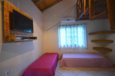Uma cama ou camas num quarto em Pousada Sítio Olho D'Água