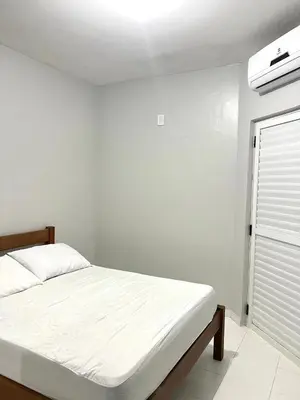 Uma cama ou camas num quarto em Residencial Melfi 3 - Apto 04 - Lateral