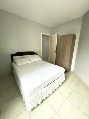 Uma cama ou camas num quarto em Residencial Melfi 3 - Apto 06 - Lateral