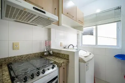 A cozinha ou kitchenette de Garden Ville · Confortável apartamento na Praia de Bombas com ótima localização