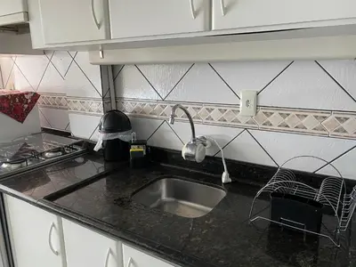 A cozinha ou kitchenette de Apartamento Aconchegante Beira Mar em Itapema - Santa Catarina