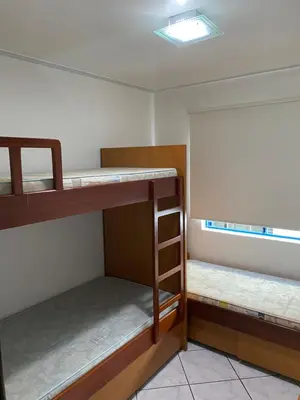 Uma cama ou camas num quarto em Apartamento Aconchegante Beira Mar em Itapema - Santa Catarina