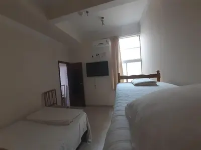 Uma cama ou camas num quarto em Pousada Maré Boa