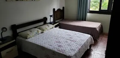 Uma cama ou camas num quarto em Apartamento Frente Mar com 02 suítes