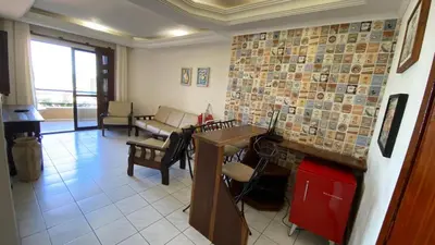 Uma área de estar em Frente Mar Apartamento 3Q em Itapema, Meia Praia, suite e 2BWC, Ar Condicionado, Smart TV, garagem e churrasqueira na sacada