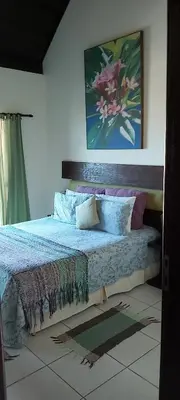 Uma cama ou camas num quarto em Pousada Olhos Verdes