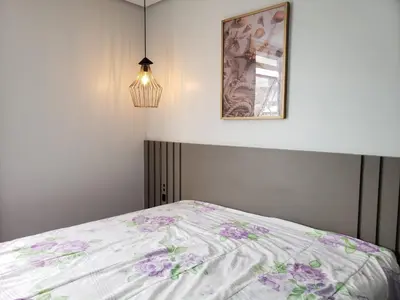 Uma cama ou camas num quarto em Apartamento novinho em Palmas!