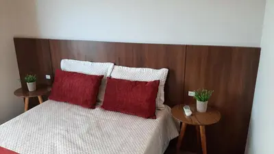 Uma cama ou camas num quarto em Excelente Sobrado Confortável no Centro de Tijucas Próximo as Praias